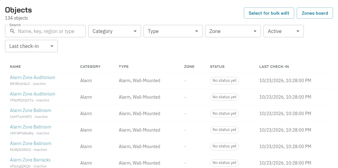 World Building › Objects: 134 objects with Search, Category, Type, Zone, Active and Last check-in filters, Select for bulk edit and Zones board, and a list of alarms with their category, type, zone, status and last check-in